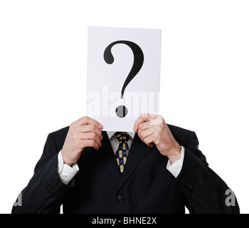 Anonymous Businessman Holding a Question Mark in Front of His Face Stock Photo