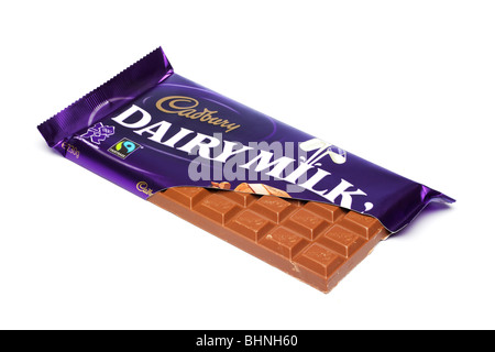 Cadbury's Dairy Milk chocolate bar in torn foil wrapper cutout Stock Photo