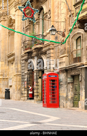 Traditional red British telephone booth, Valletta Stock Photo