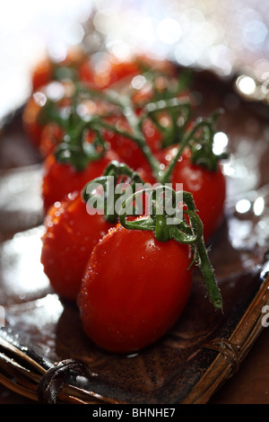 Fresh cherry tomatoes with stem vegetable veg food vine agriculture diet garden grocery salad abstract close up selective focus Stock Photo