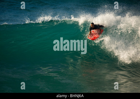 Surfers on the El Lloret wave in Las Palmas de Gran Canaria Stock Photo