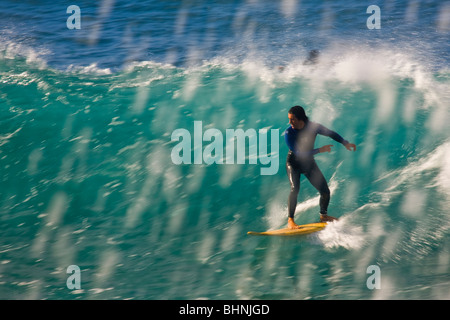 Surfers on the El Lloret wave in Las Palmas de Gran Canaria Stock Photo