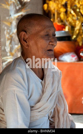 Elderly Buddhist nun at Angkor Wat, Siem Reap, Cambodia Stock Photo