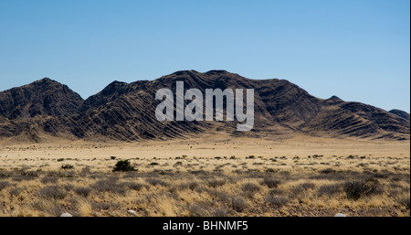 Black mountain showing folded strata. Geology. Namibia Stock Photo