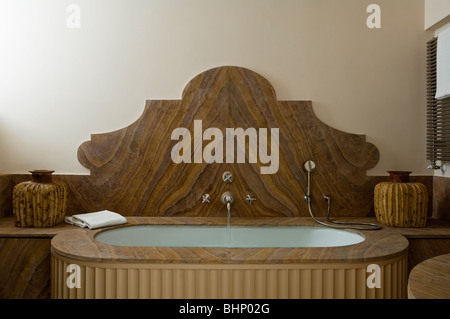 Wood grain bathtub in bathroom of converted Italian farmhouse Stock Photo