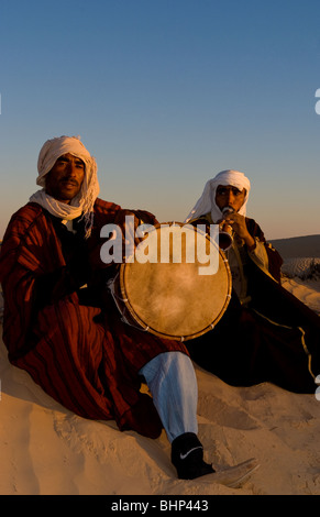 Bedouin men playing music in Sahara desert in Douz Tunisia Africa Stock Photo