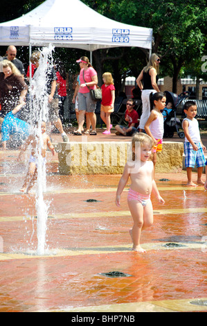 Kids playing in fountain, Texas, USA Stock Photo