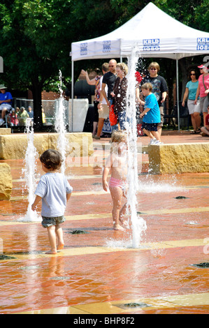 Kids playing in fountain, Texas, USA Stock Photo