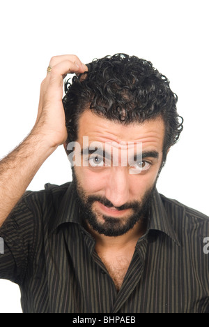 25 years old Middle Eastern man confused and scratching his head Stock Photo