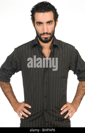 Serious 25 years old Middle Eastern man hands on waist Stock Photo