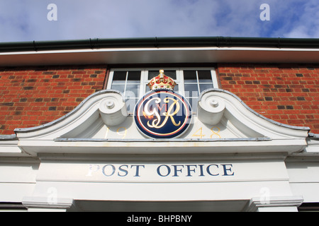 George VIs royal cypher on the Post Office and General Store, Crown Estate village, Windsor Great Park, Windsor, Berkshire, England, Great Britain, UK Stock Photo