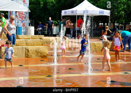 Kids playing in fountain, Texas, USA Stock Photo