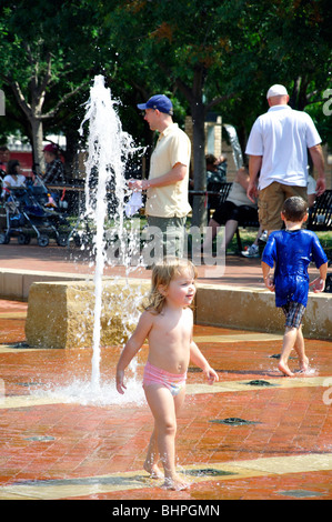 Kids playing in fountain, Texas, USA Stock Photo