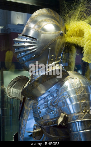 Breastplate and feathered helmet. Classic Medieval Full Suit of Armor. Stock Photo