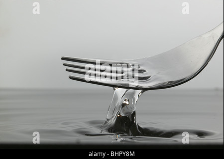 Fork in water Stock Photo