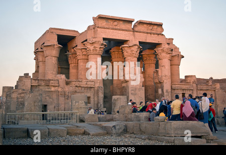 Tourist group listening to guide in front of the double entrance to Kom Ombo temple. Stock Photo