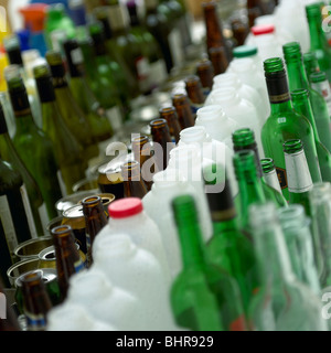 Bottles cans and tins lined up Stock Photo