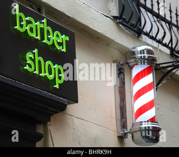 A barber shop sign in a U.K. city. Stock Photo