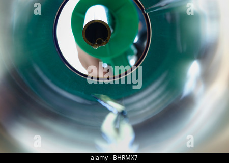Petrol trickling down a petrol pipe from a pump Stock Photo