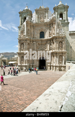 view of plaza & entrance facade of historic stone Basilica of Our Lady of Solitude dedicated to patron saint city of Oaxaca de Juarez Mexico Stock Photo