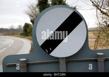 Circular black band and white circle road sign meaning restriction