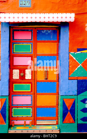 Vividly colourful painted front door on the island of Murano, Italy Stock Photo