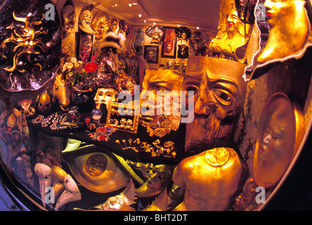 Variety of masquerade carnival masks on display inside shop in Venice, Italy Stock Photo