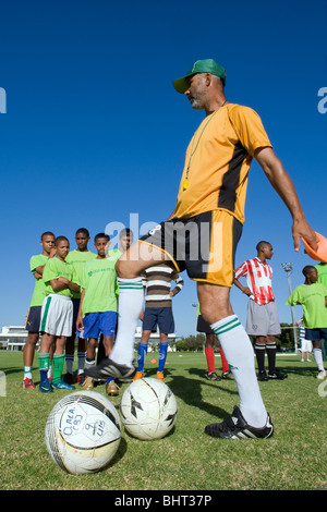 Coach instructing players at Old Mutual Football Academy, Cape Town, South Africa Stock Photo