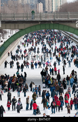 Skaters enjoy a day out on Ottawa's Rideau Canal, the worlds largest skating rink. Stock Photo