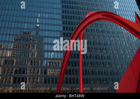 A reflection of the Willis Tower, formerly known as the Sears Tower pictured with Alexander Calder’s Flamingo sculpture in Feder Stock Photo