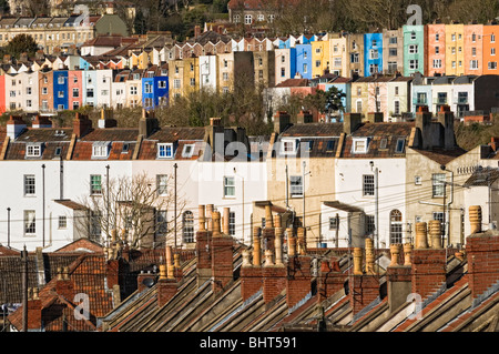 Old terraced housing tightly packed on a hill in sunlight Stock Photo