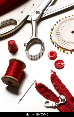 sewing buttons and zipper on white background Stock Photo - Alamy