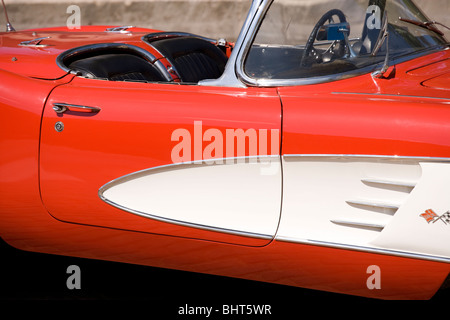 Red vintage Chevrolet Corvette convertible. C1 body from 1958, 59 or 1960. Roman Red with white coves. Stock Photo