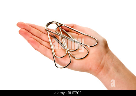 hand on white holding giant paper clip Stock Photo