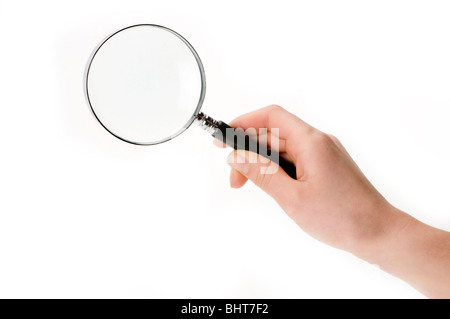 hand on white with magnifying glass Stock Photo