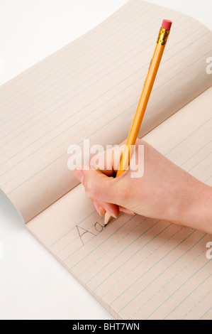 hand on white writing on pad with pencil Stock Photo