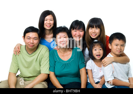 Asian family portrait on white background, three generations. Stock Photo