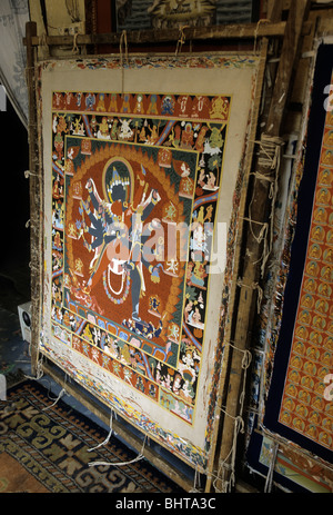Thangka (Tibetan silk painting) in artists' shop in the UNESCO World Heritage town of Bhaktapur- Kathmandu Valley,  Nepal Stock Photo
