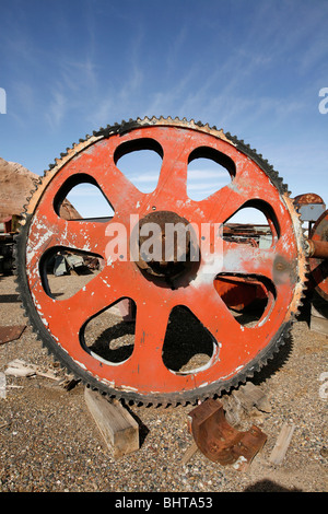 Gigantic industrial gear in scrap yard. Stock Photo
