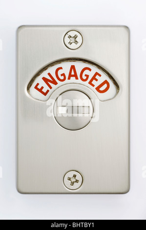A toilet door lock showing engaged Stock Photo