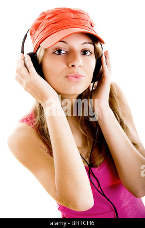Beautiful young woman listen music isolated on white Stock Photo