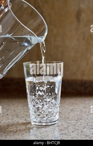 Pouring a glass of water Stock Photo