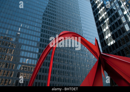 A reflection of the Willis Tower, formerly known as the Sears Tower pictured with Alexander Calder’s Flamingo sculpture in Feder Stock Photo