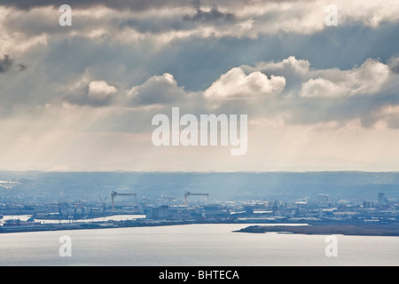 View across Belfast Lough toward the city from the summit of Knockagh in County Antrim, Northern Ireland Stock Photo