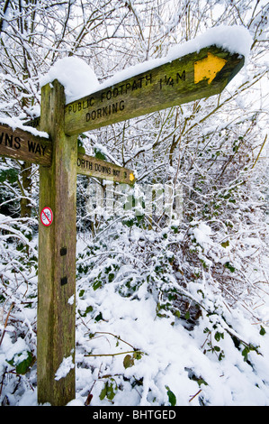 North Downs Way signpost covered with snow, near Dorking, Surrey, UK Stock Photo