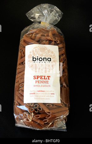 Packet of Biona organic spelt penne pasta on black background Stock Photo