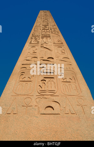 Close-up of the red granite obelisk of Ramesses the Great at the main entrance of Luxor Temple (a UNESCO World Heritage Site) in Luxor, Egypt Stock Photo