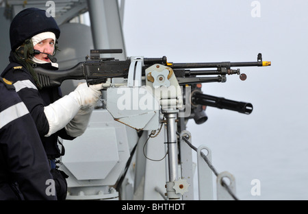 “Royal Navy' general purpose machine gunner on HMS Albion, UK Stock Photo