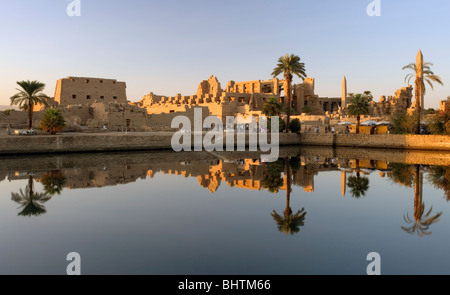 Temple of Karnak reflecting in sacred lake at sunset in Luxor, Egypt. Stock Photo