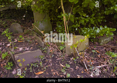 Derelict overgrown graveyard in former mining village of Cwmcarn South Wales UK Stock Photo